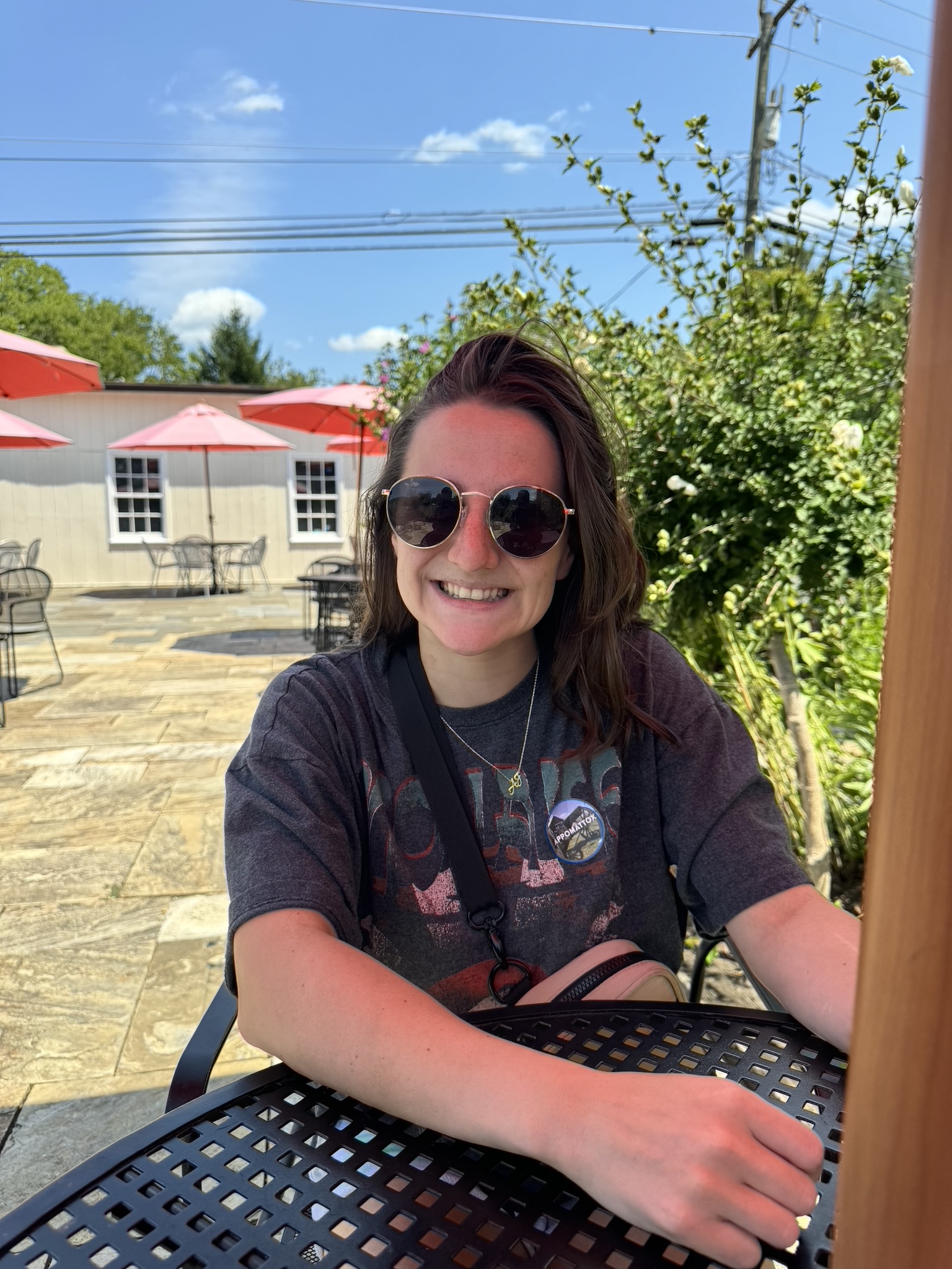 Rachel smiling at an outdoor café